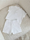 Completo bambino Alex bianco - maglietta con bottoni e pantaloncini in cotone