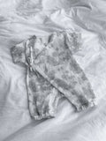 Tuta neonato Poppy in cotone mussola – vista flat